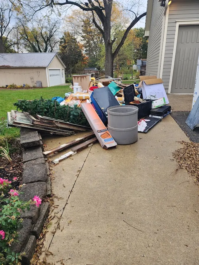 Dumpster being loaded with debris for 3 Yard Dumpster Rental in Great Neck Plaza